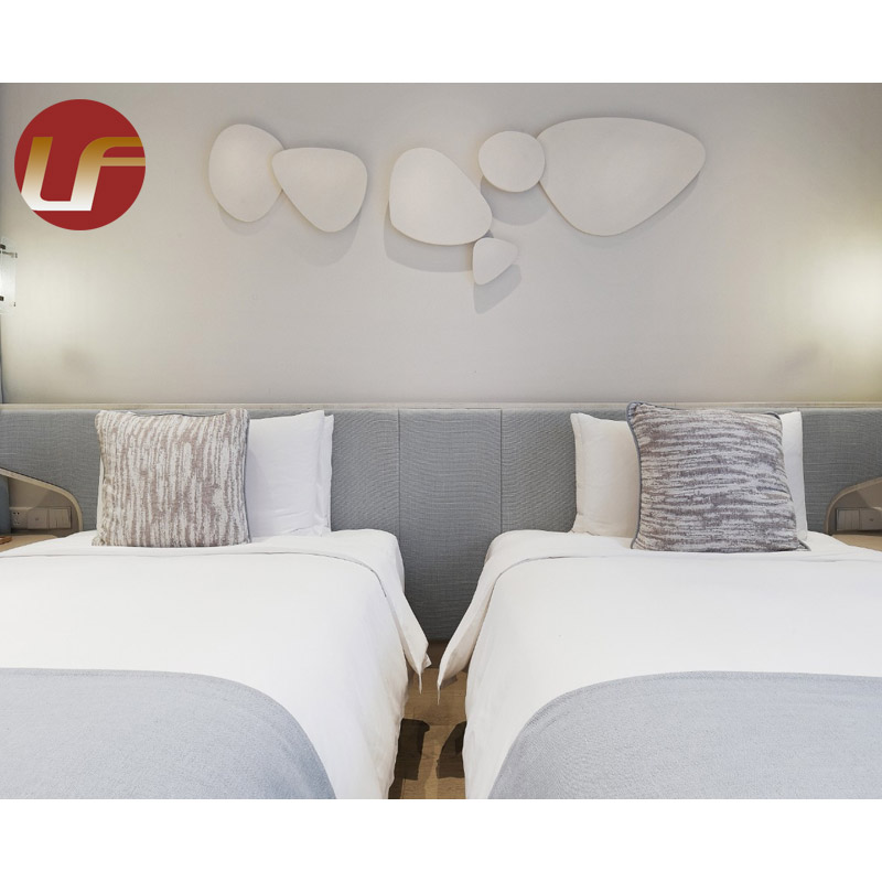 La chambre à coucher en gros imprimée adaptée aux besoins du client de meubles d'hôtel place les ensembles confortables mous de lit d'hôtel